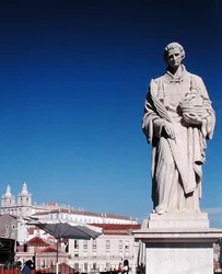 Statue of St Vincent with the Monastery of San Jeronimo in the background